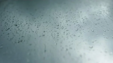Window is covered with raindrops flowing down Stock Footage 202644212