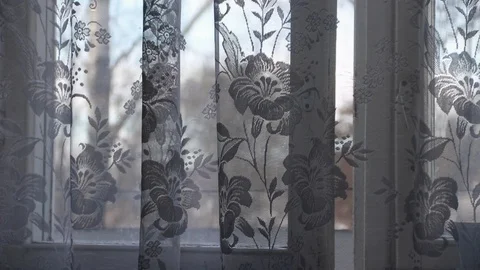 Window curtain develops in the wind. White curtain. The wind blows. Video stock 106568999