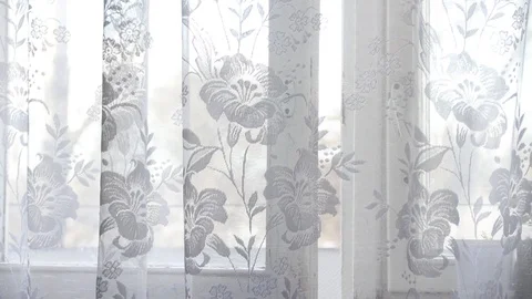 Window curtain develops in the wind. White curtain. The wind blows. Video stock 106569630