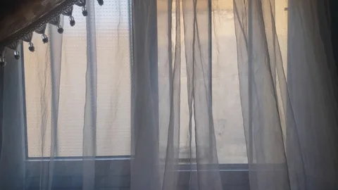 Window curtain moving with the wind Stock Footage 128234824