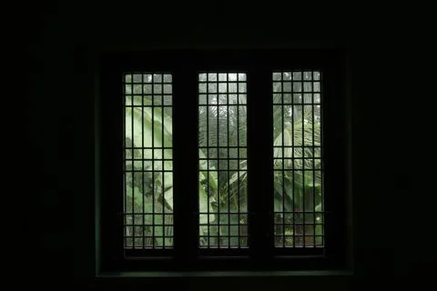 A window in a dark room Stock Photos