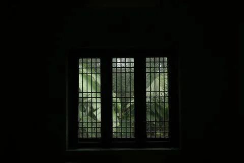 A window in a dark room Stock Photos
