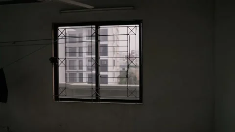 A window in a dark room in winter day Stock Footage 232508020