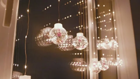 Window decorated with a garland with balls Stock-Footage 165381044