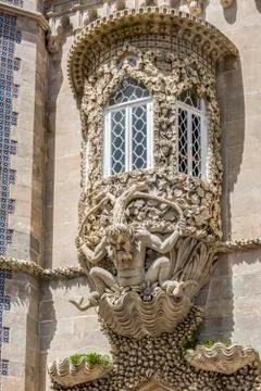 Window decorated with grotesque gargoyle on a facade of the Palacio da Pena Stock-Fotos