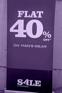 Window display with 40 % discount board at a shop, india. Stock Photos