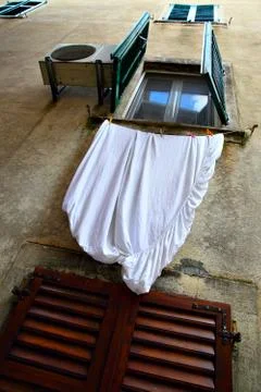 Window with drying linen Stock Photos