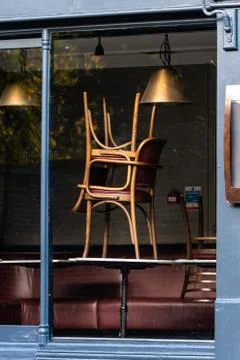 Window of an empty restaurant forced to close amid COVID-19 pandemic Stock Photos