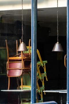 Window of an empty restaurant forced to close amid COVID-19 pandemic Stock Photos