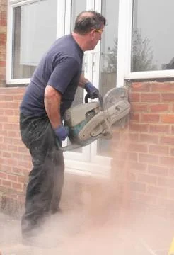 A window fitter using a disc cutter Stock Photos
