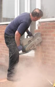 A window fitter using a disc cutter Stock Photos