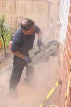 A window fitter using a disc cutter Stock Photos