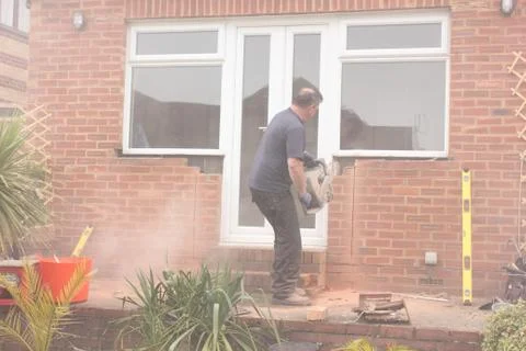 A window fitter using a disc cutter Stock Photos