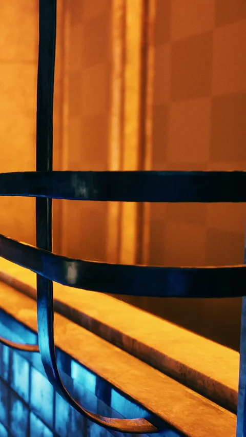 Window frame casting shadows on a wall with warm colors in the background Stock Footage 341266489