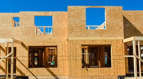 Window frame of new low rise building on blue sky background. Foto stock