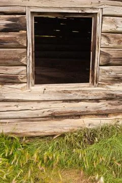 Window frame in old log cabin Stock Photos