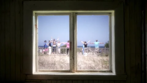 Window Frame Overlooking Yoga Group Practice Outside Zoom Out Video stock 291860669