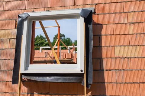 Window frame in wall on construction site Stock Photos