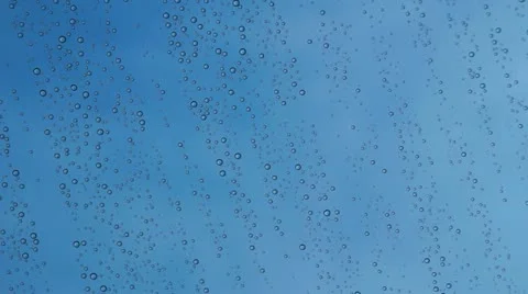 Window glass after rain, blue sky background Stock Footage 10918570