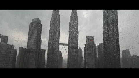 Window glass view of tower tower kuala lumpur malaysia, raining dark clouds Stock Footage 292975330