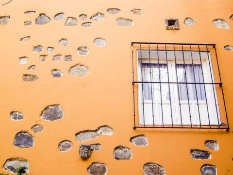 Window on gold stone wall Stock Photos
