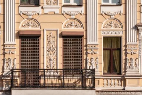 Window with a grating and a balcony. Stock Photos