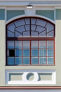 Window on a gray wall. Stock Photos