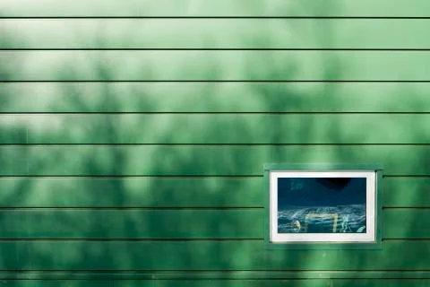 Window on green wall Stock Photos