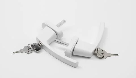 Window handle with lock and keys, protection and safety from falling out of.. Stock Photos