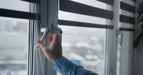 Window handle lock with key in man hands. Home safety window lock for baby Stock Footage 148433369