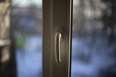 Window handle. Plastic windows in the apartment. Handle for opening the windo Photos