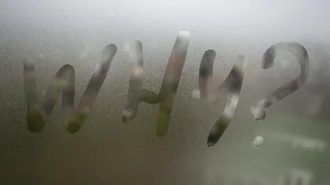 Window with handwritten word why Stock Photos