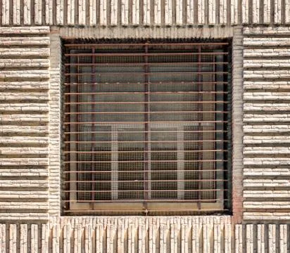  Window with horizontal bars on a brick wall Stock Photos