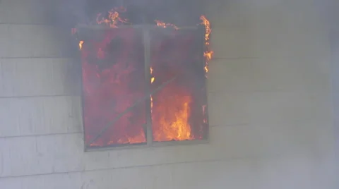 Window of house burns with fury Stock Footage 60959366