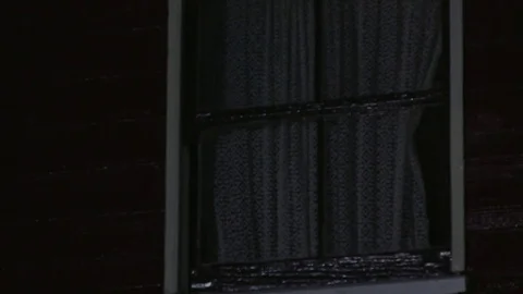 Window of a house with curtains Stock Footage 84807436