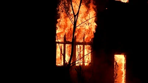 The window of the house is on fire, the night flame of the disaster. Stock Footage 330002344