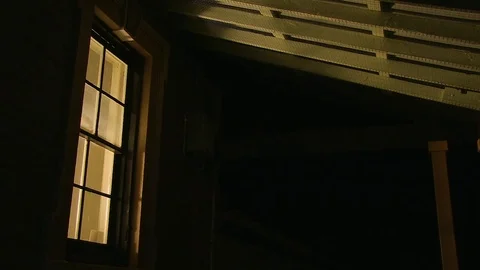 Window of a house with yellow light Video stock 84952995