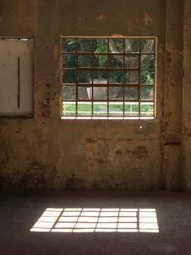Window with iron bars in old wall Stock Photos