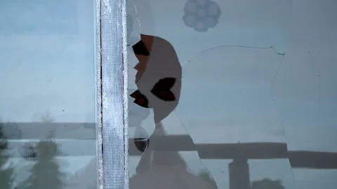 In the window of the kindergarten, hooligans broke the glass with a stone  Stock Footage 119495491