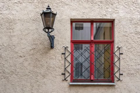 Window with a lantern. Stock Photos