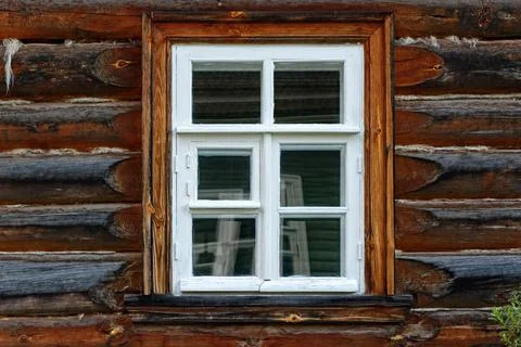 Window in a log house. Stock Photos