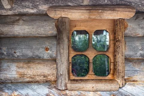 Window of a log house. Stock Photos