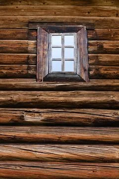 Window in a log wall Stock Photos