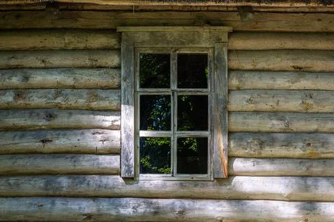 Window on a log wall. Stock Photos