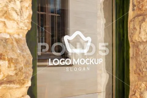 Window logo mockup in historic old town for timeless brand promotion PSD Template