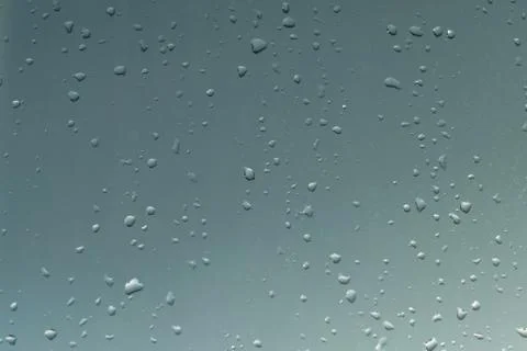 On the window a lot of different droplets from the rain. Stock Photos