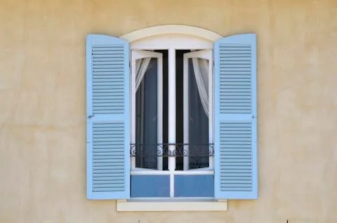 Window with louvre doors Stock Photos