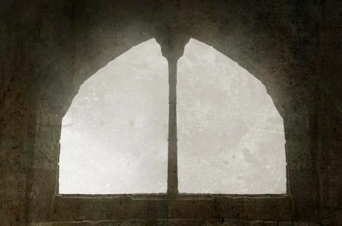Window in a medieval style, arched window on a facade of medieval wall. Stock Photos