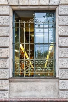 Window with metal bars. Stock Photos
