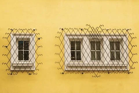 Window with metal security grid Stock Photos
